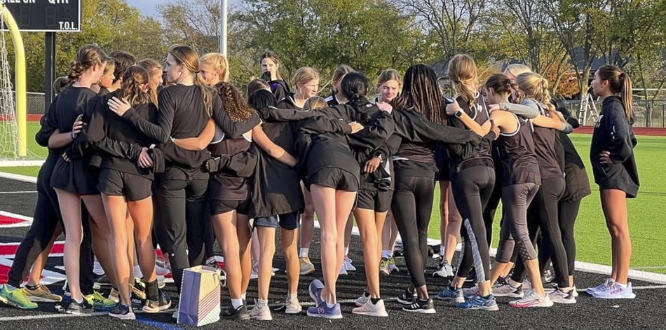 WSMS and LHS harrier girls huddle before the races