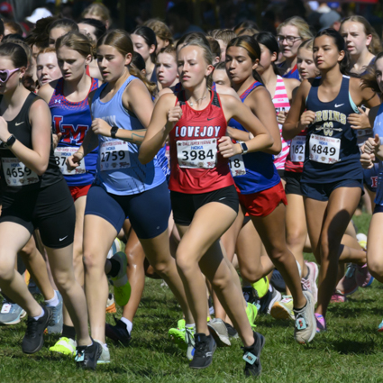Macy Moore racing on Saturday at the Chile Pepper XC Invitational