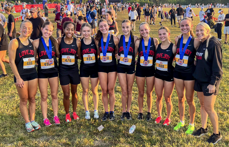 Lovejoy's Varsity Girls Elite squad with Coach Carly